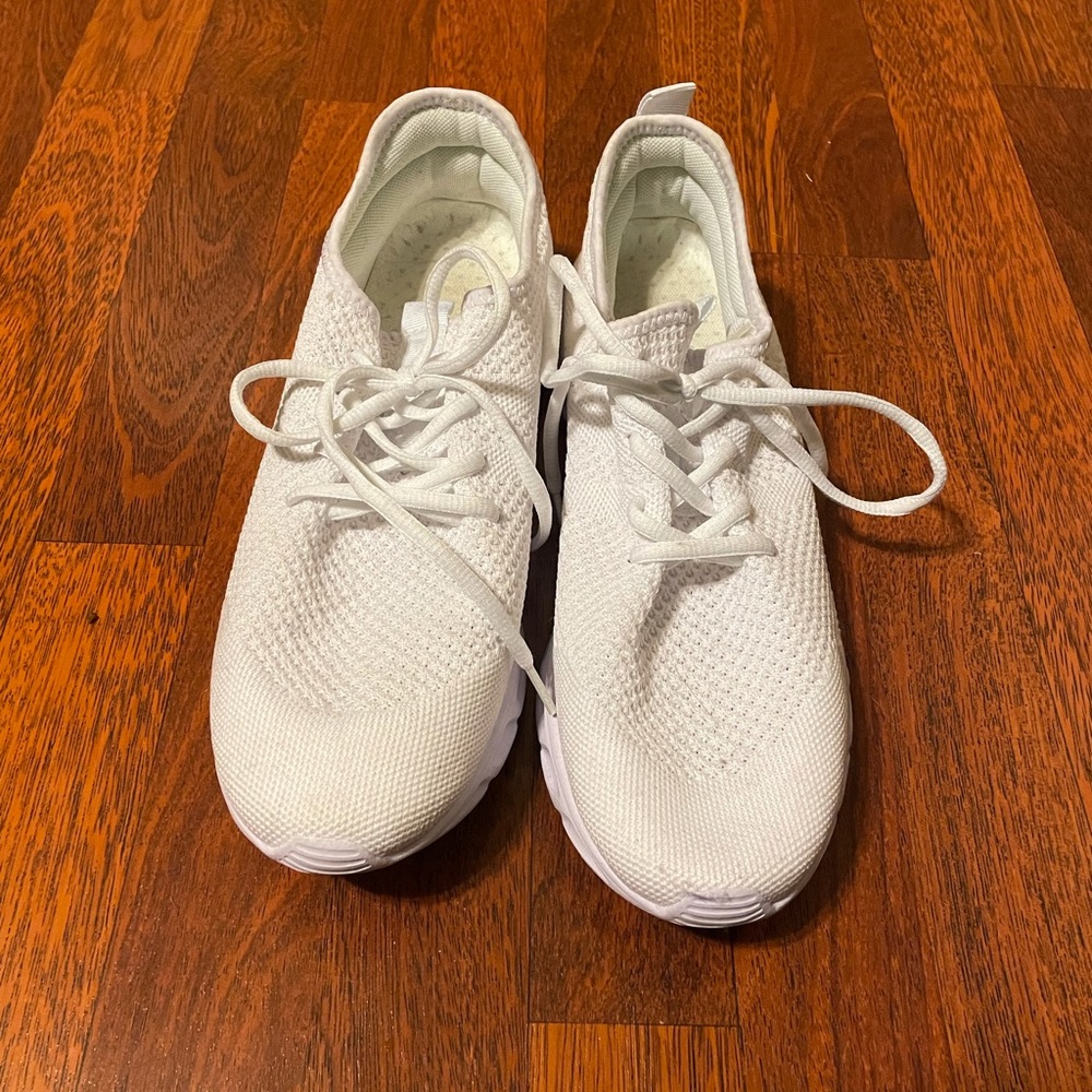 lightly used non brand white work out shoes.